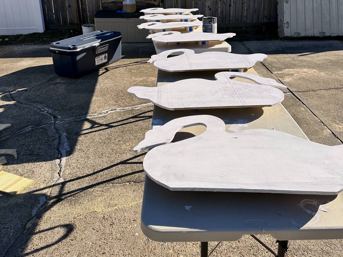 Newly cut geese laid out on a worktable for painting